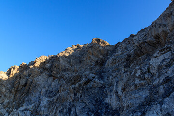 Rocky ascent towards mountain summit Grand Muveran in Swiss Alps, Switzerland