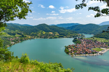 The small town of Divic in Bosnia on the bank of the Drina River, surrounded by the Balkan Mountains