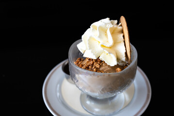 Cup of ice cream with crumble nuts and whipped cream in Keerbergen, Flemish Brabant, Belgium
