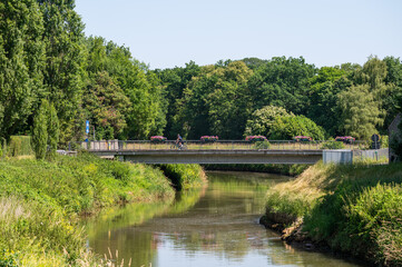 Bridge over the river Dyle with green surroundings in Rijmenam, Bonheiden, Flemish Brabant, Belgium