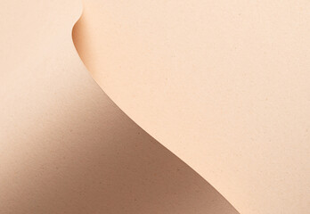 Beige designer paper texture with sandy, minimalistic backdrop. Premium, chic sheet with wave fold,