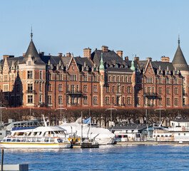 Elegant Östermalm waterfront with ornate facades and moored boats