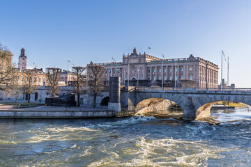 Swedish Parliament building and bridge with rapid water flow