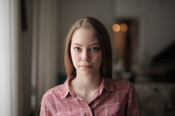 portrait of a young woman at home