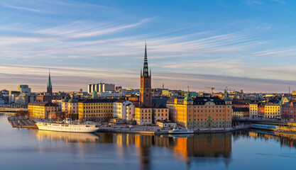Historic buildings and Riddarholmen Church reflecting in Stockholm waters