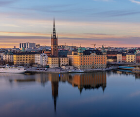 Fototapeta premium Sunset cityscape of Stockholm with Riddarholmen and Old Town waterfront