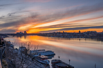 Dramatic sunset over Kungsholmen with bridge and city silhouette