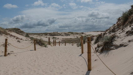 The vast sandy bech near Leba/Poland  in Central Europe a spit  between  the Baltic sea and the lake. It is  a popular tourist destination in he summer. Part of the Slowinski National Park.
Some place