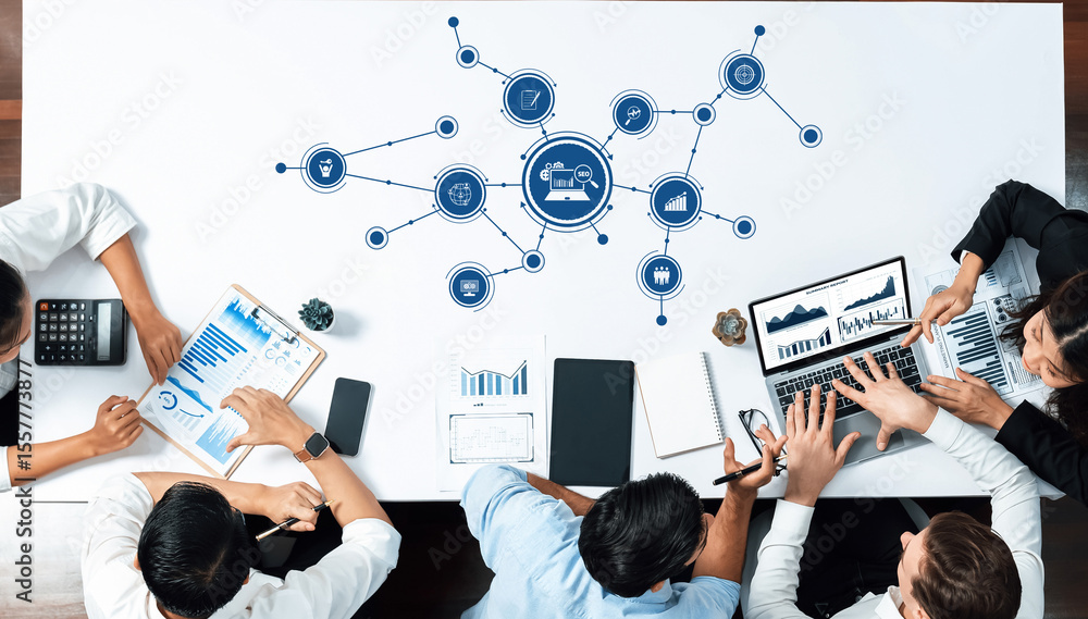 Aufkleber A dynamic business meeting setting featuring professionals engaged in data analysis and technology discussions, emphasizing collaboration and modern office tools. Amity