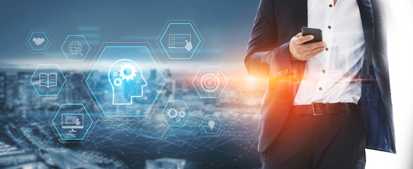 Head with gear and icons representing learning, digital training, and development process, showing...
