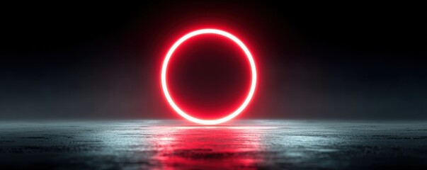 Red neon glowing circular light ring on reflective black surface