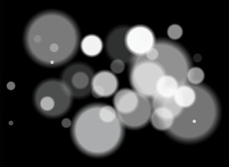 White blurred circles on dark background with smooth soft edges. Overlapping glowing bokeh creates dreamy abstract depth and festive atmosphere without clear focal point.
