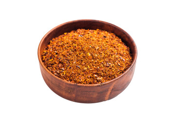 Chili pepper and paprika red flakes in a bowl isolated on white background. top view