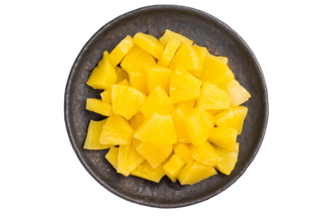 Pineapple chunks slices in a plate isolated on white background. top view