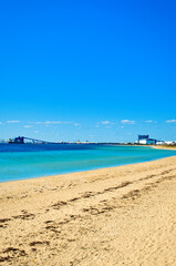 Rockingham, WA  Australia - 08312022 Rockingham foreshore makeover with colourful umbrellas and seats, next to the beautiful blue Indian Ocean.