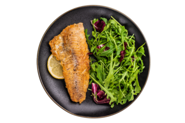 Roasted Haddock fish fillet on a plate with salad isolated on white background. top view