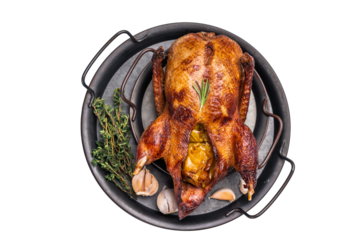 Roasted whole goose on steel tray isolated on white background. top view