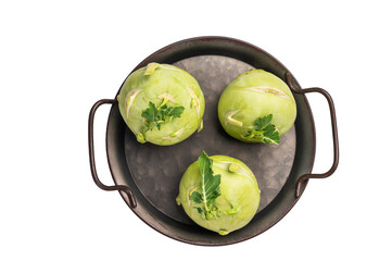 Raw kohlrabi on steel tray, Vegetable from Organic farm isolated on white backround. top view