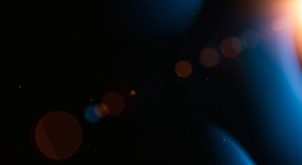 Blue light leaks and gradient over an abstract grainy background. Grainy colorful warm blue light leaks on a black background with a dust texture. Blue wavy abstract background for presentation	