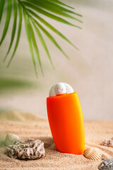 Sunblock or sunscreen in cosmetic tube on beach sand and beige background. Summer vacation and skin care concept with starfish and sea shells, spf uv-protect cosmetics. Skin health. High quality photo