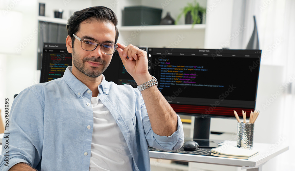 Poster profile's smart it developer looking camera to pose wearing glasses against on software development 