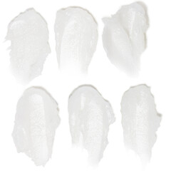 Set of soft white cream smears on empty background