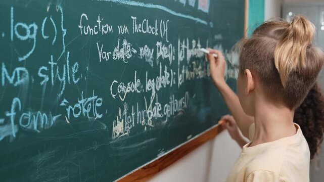 Diverse student studying coding engineering prompt while writing answer on blackboard. Intelligence children planning and learning about coding development plan. Successful boy sharing idea. Pedagogy.