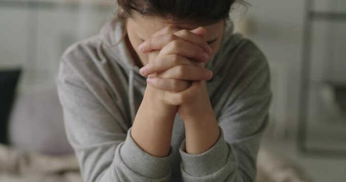 Sad young woman dealing with loss and psychological trauma