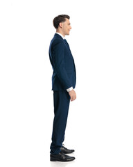 happy young businessman in navy blue suit standing in line and smiling