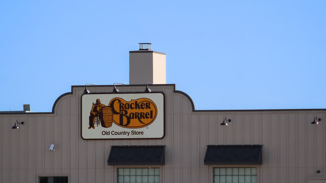 Crawfordsville, Indiana - June 27, 2025: Close-up of a Cracker Barrel restaurant sign and building isolated against the sky. For Editorial Use.