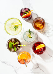 Alcohol cocktail drinks at white background.