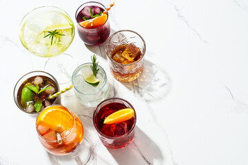 Alcohol cocktail drinks at white background.