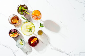 Alcohol cocktail drinks at white background.