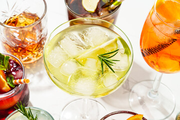 Margarita and other summer alcohol drinks at white background.