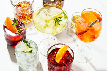 Margarita and other summer alcohol drinks at white background.