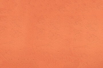 Textured background. Decorative plaster stucco concrete walls, external decoration of facade. Texture of yellow brown beige. Baked clay similar to cement or terracotta background. coating .Rustic wall