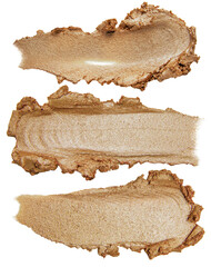 Collection of golden cream smears on white background