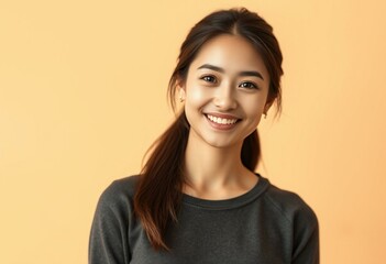 Portrait of a smiling female on a warm pastel background