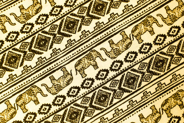 
fabric with elephants on it. geometric background with animals