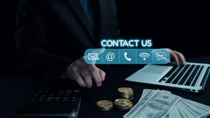 This image represents a blend of modern business communication and financial technology, showcasing a laptop, money, and contact options on a dark background. Qubit - Powered by Adobe