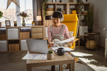 Japanese woman hold document contract work at home