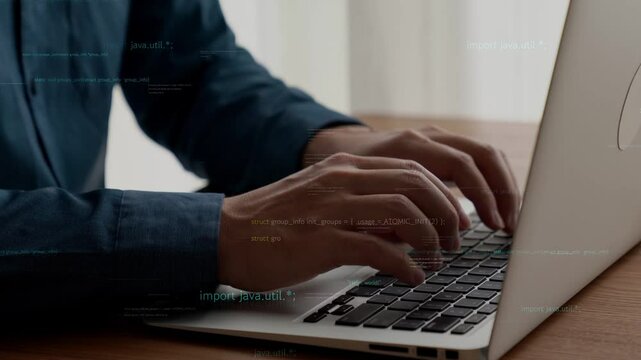 Computer programmer uses capable laptop computer to develop programming code of new software . Computer specialist working on future coding application for software programming development .