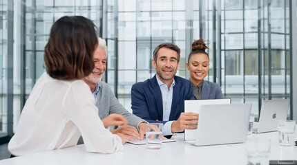 A team of professional business coworkers in the office collaborating on a corporate project