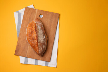 Beautiful and delicious artisan bread on a light background, top view
