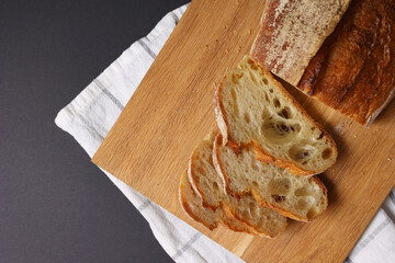 A Beautiful Composition of Artisan Bread Slices Presented on a Dark Background Surface