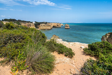 Praia da Marinha Beach among rock islets and cliffs seen from Seven Hanging Valleys Trail, Algarve,...