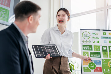 Green business leaders discuss ESG strategy for net zero carbon reduction with innovative solar...