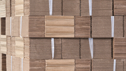 Elements of corton boxes are collected in stack. Conveyor line for the production of boxes. Machine...
