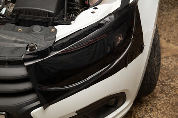 Tinting of the rear headlights of the car.Car design.Detaling center
