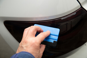Tinting of the rear headlights of the car.Car design.Detaling center